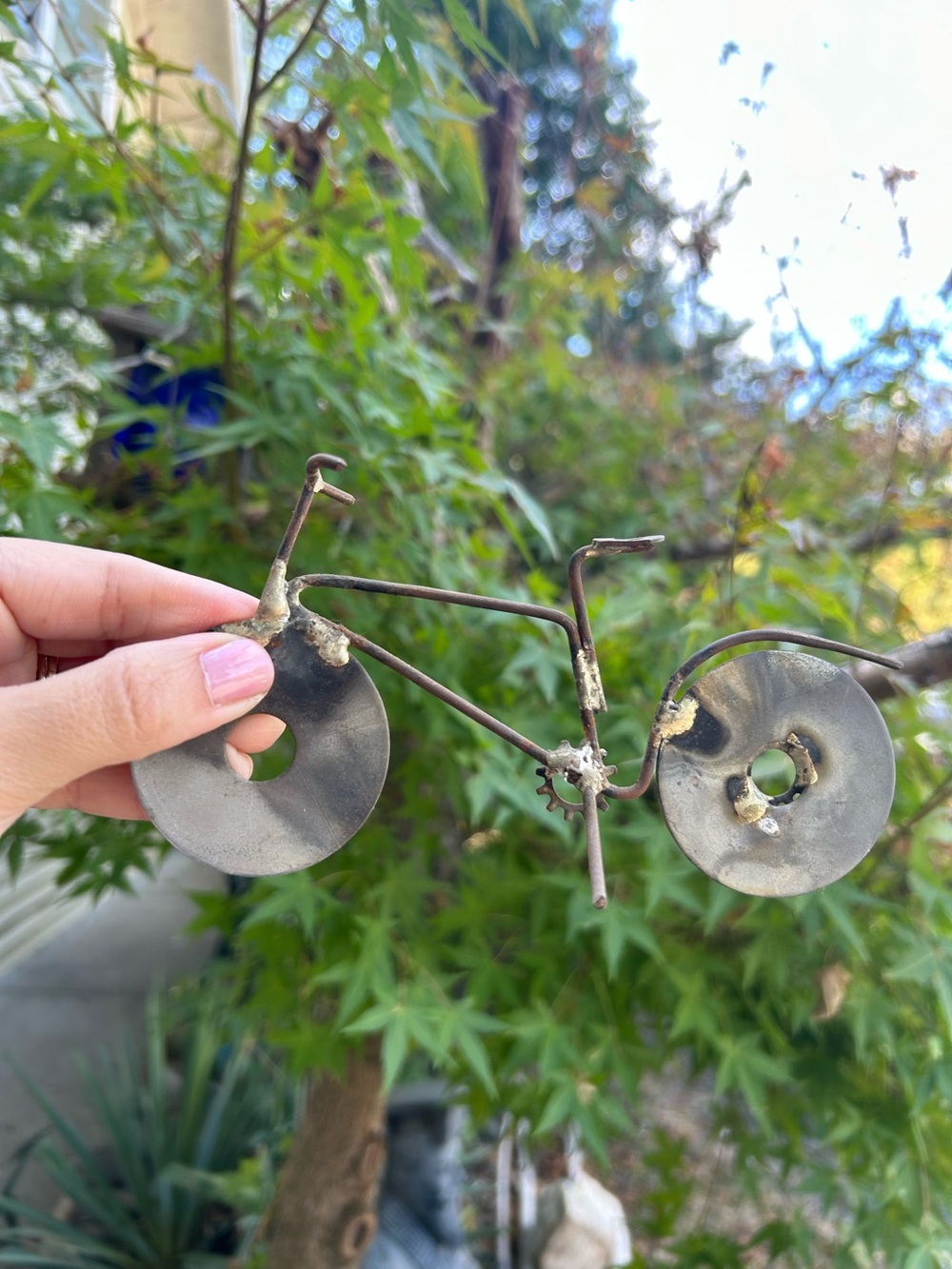 handcrafted miniature bicycle sculpture made from recycled metal parts